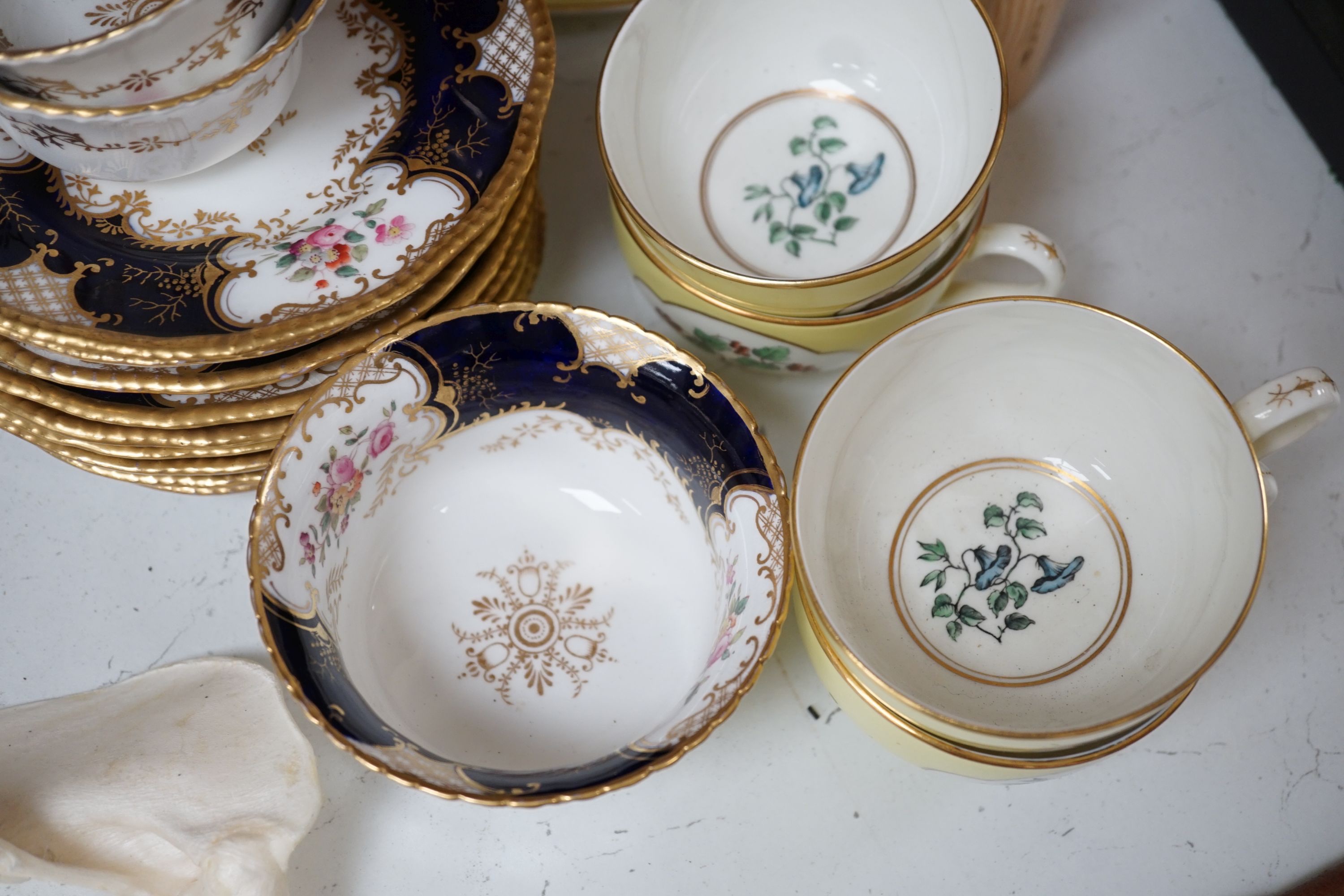 Royal Worcester for Aspreys - a set of six flower painted cups and saucers and four sideplates together with a Coalport part tea set